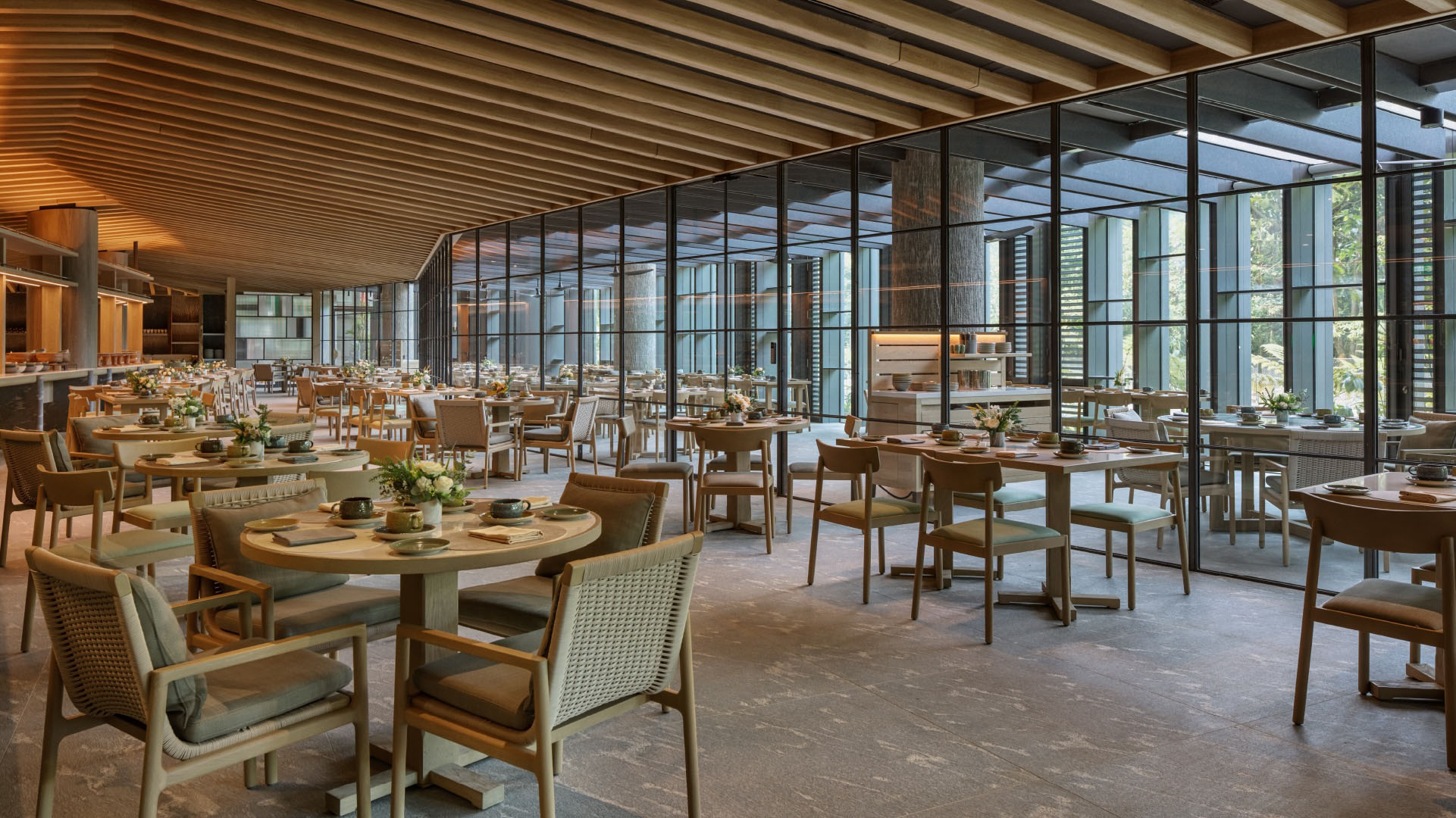 This all-day dining restaurant offers a diverse selection of local and international cuisine featuring buffet options for breakfast and dinner, with live cooking stations and roving tableside service for an interactive dining experience.